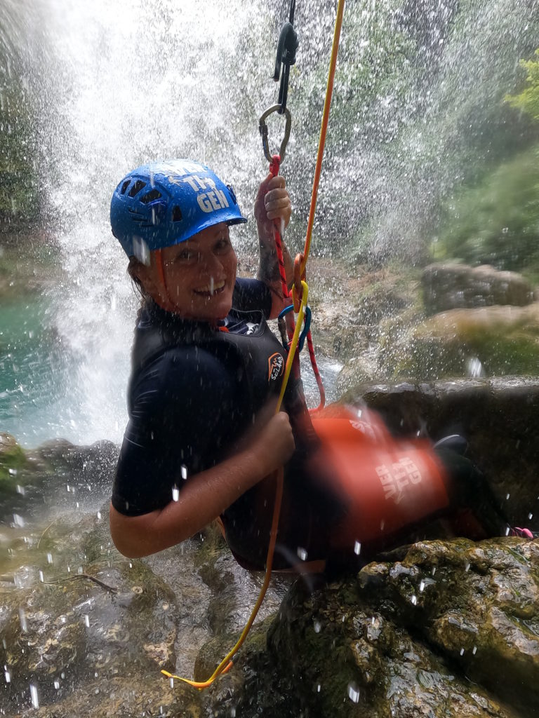 Holly abseiling in valencia during canyoning activity